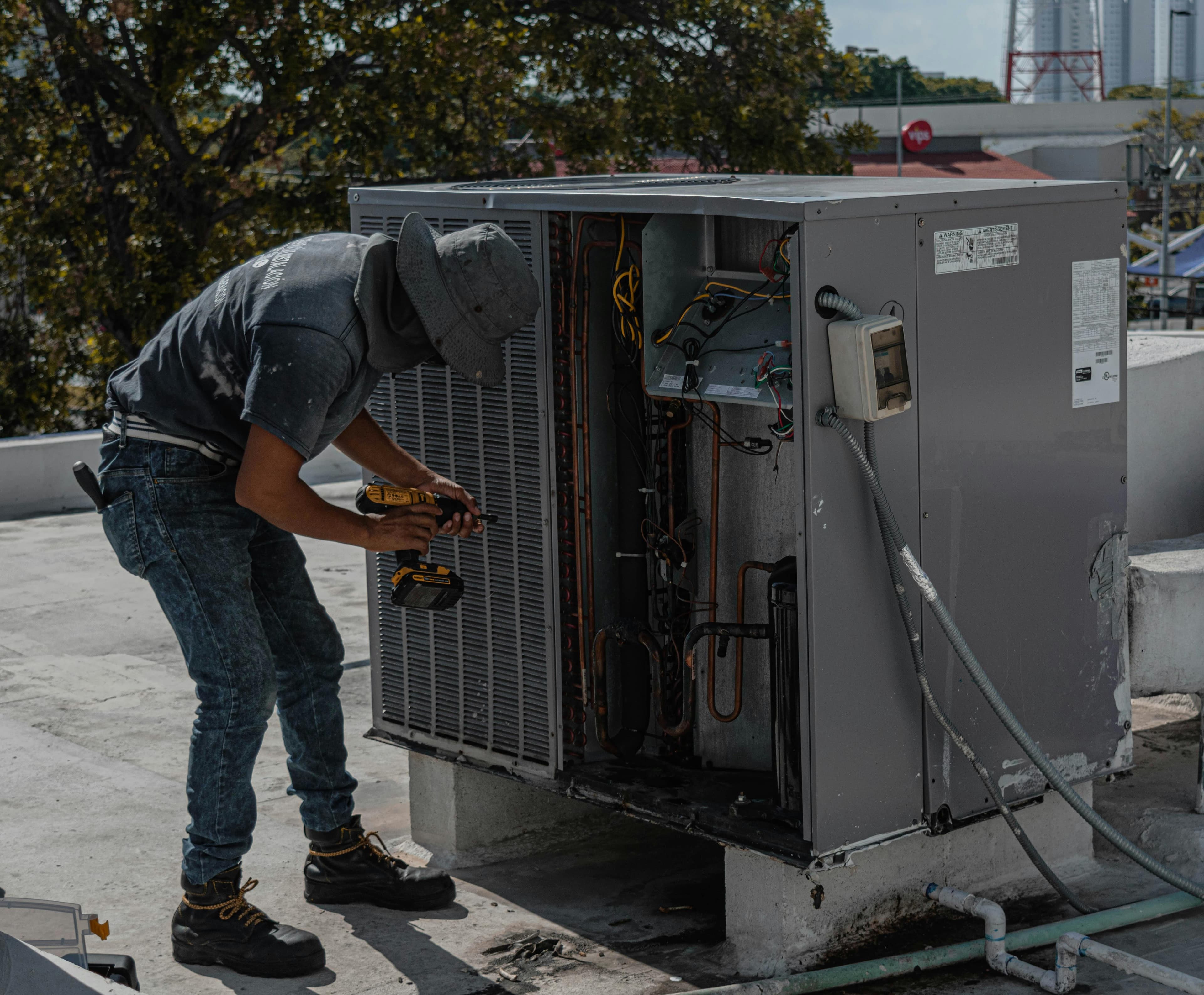 HVAC technician servicing heating and cooling equipment